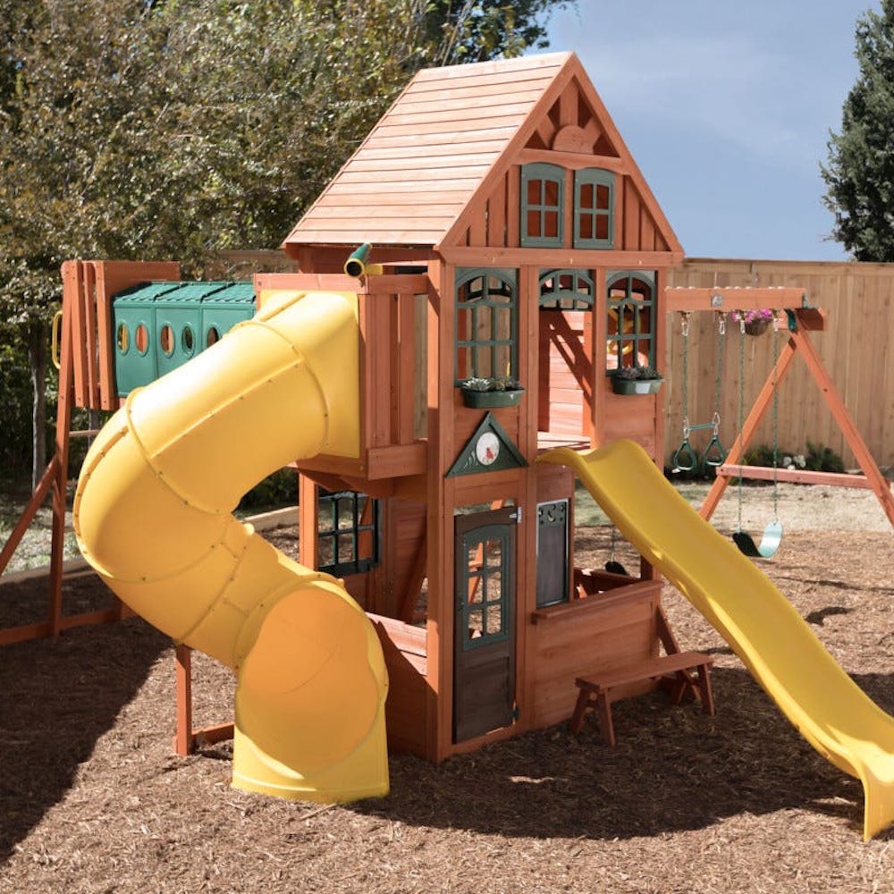 kidkraft orchard view manor playset in back yard