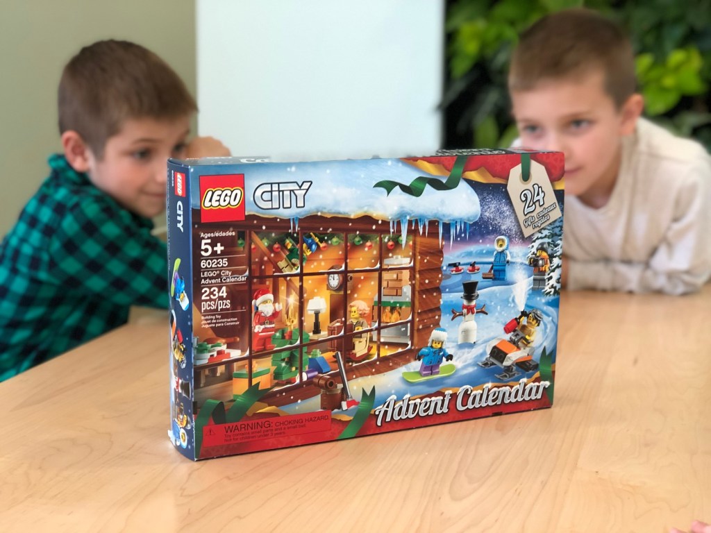 two boys sitting by LEGO City Advent Calendar