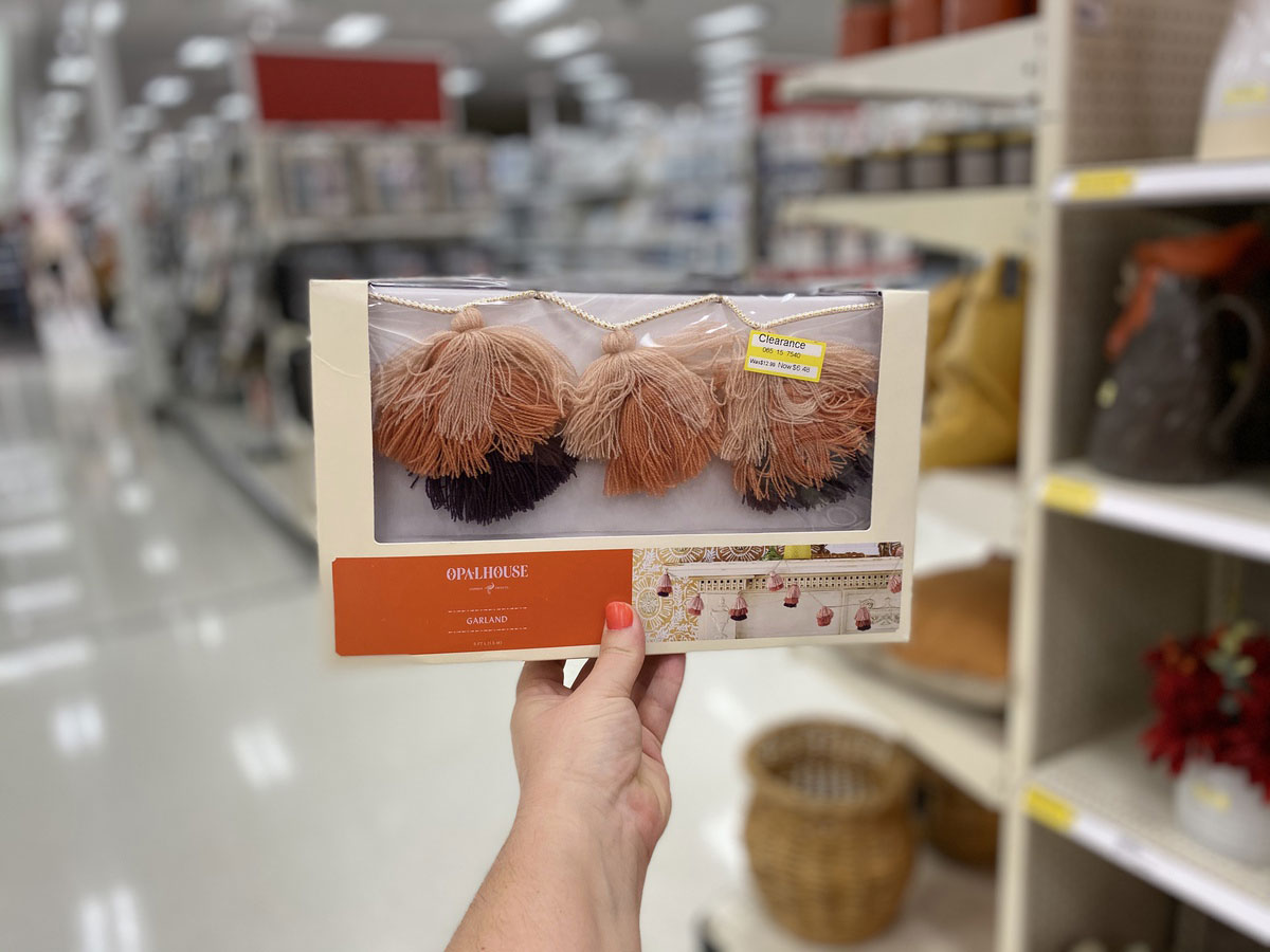 woman holding opalhouse decorative tassels