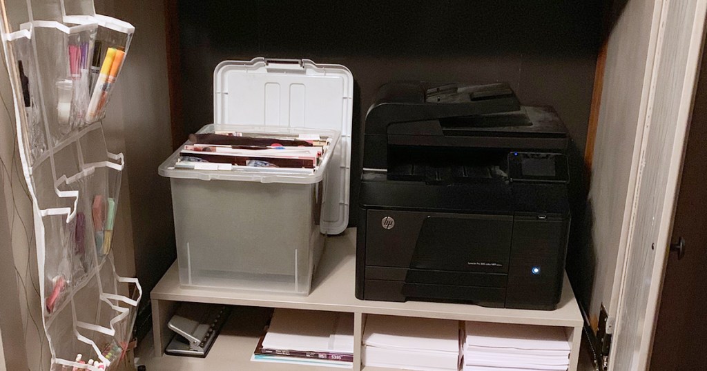 Printer and school supplies inside refinished cabinet