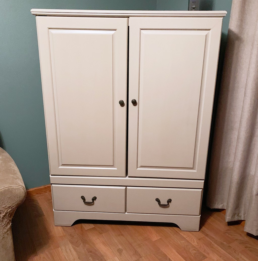 Refinished cabinet for concealing school and work supplies