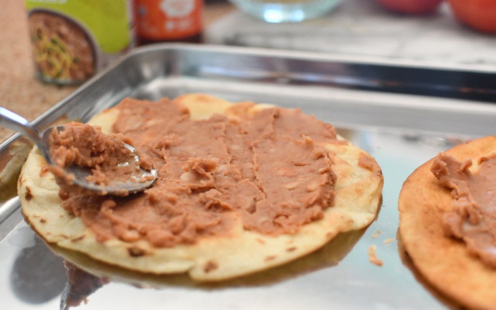 refried beans on tortilla