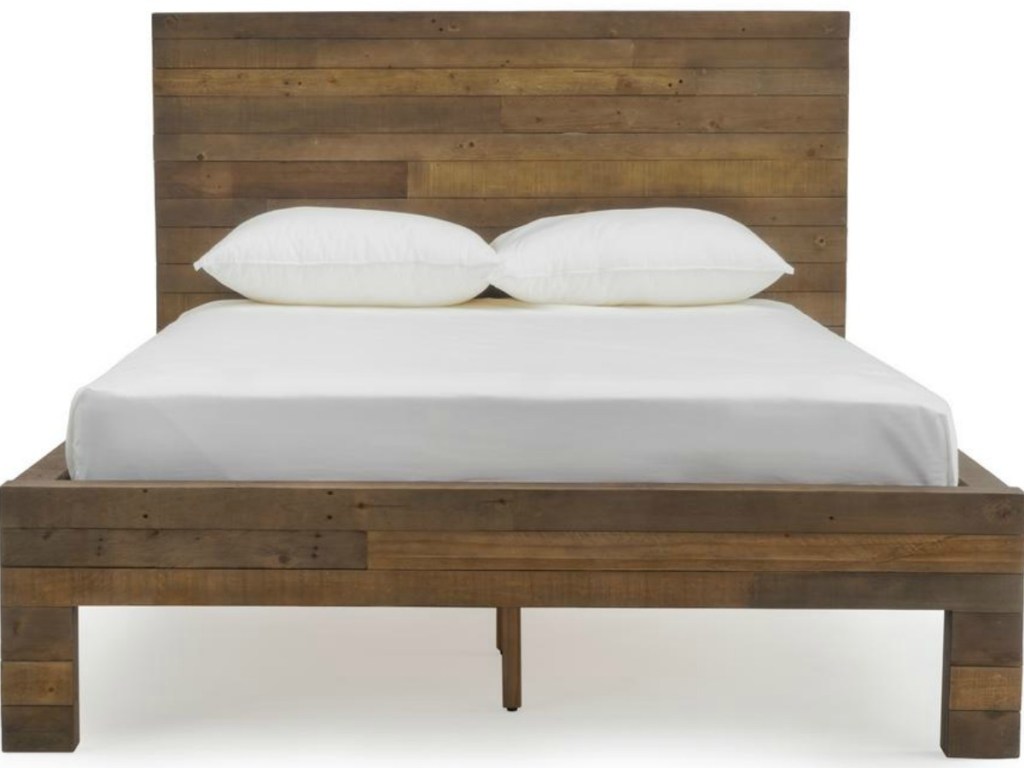 bed in wood with mattress and pillows