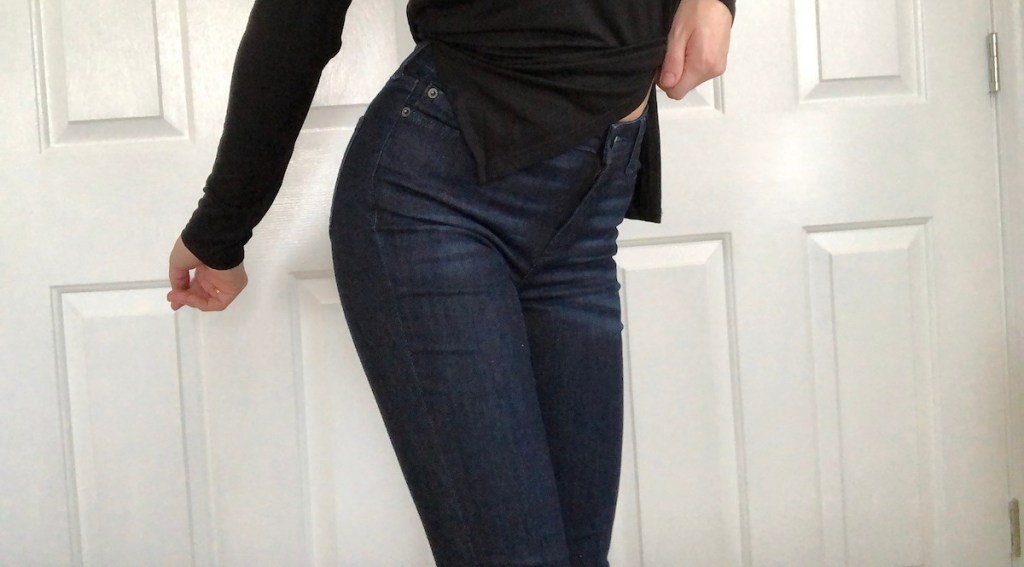 woman wearing amazon jeans and black shirt