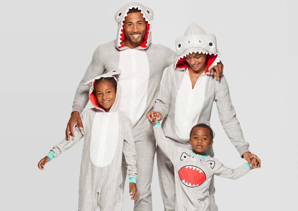 family wearing matching shark pajamas