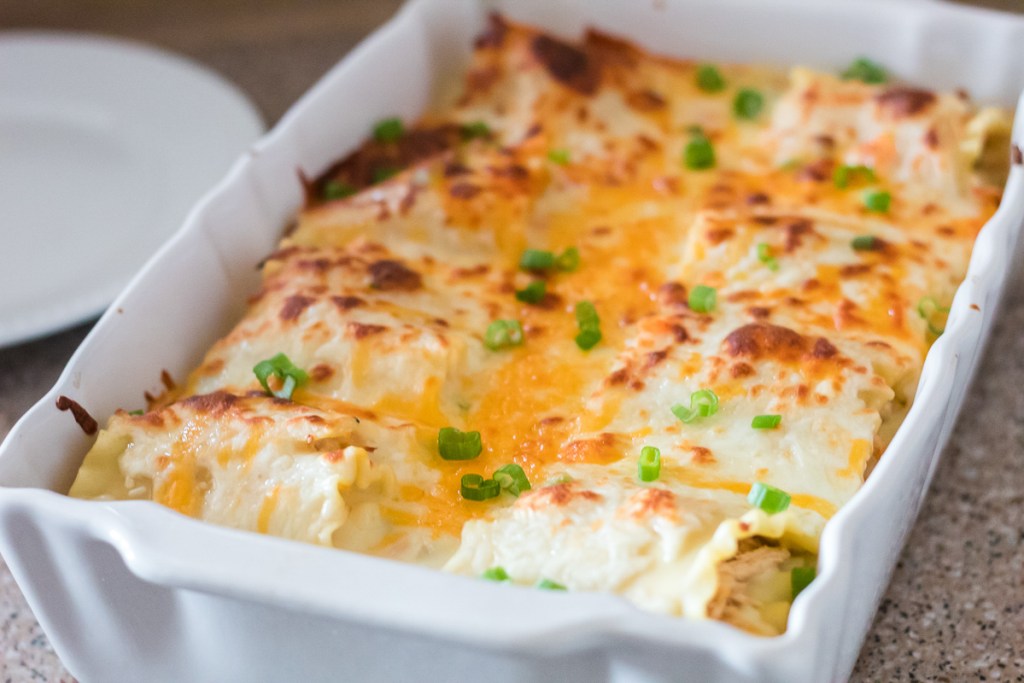 casserole dish of spicy chicken lasagna roll-up