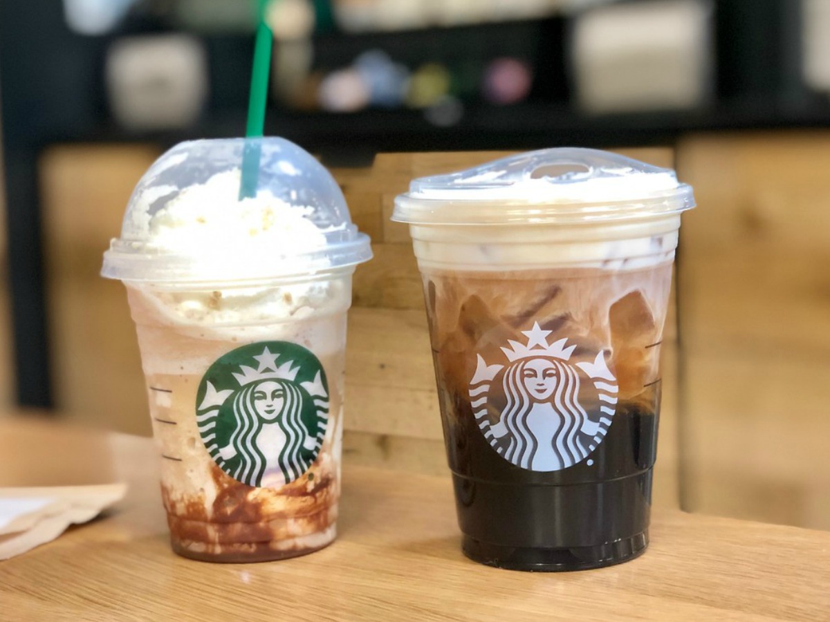 two coffee drinks sitting on table