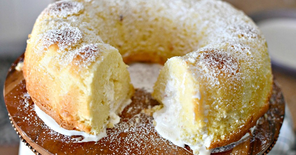 homemade twinkie cake sliced open on a cake plate 