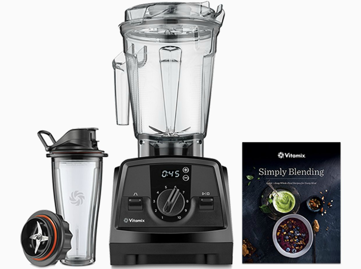 vitamix 1200 shown with blender jar and cookbook