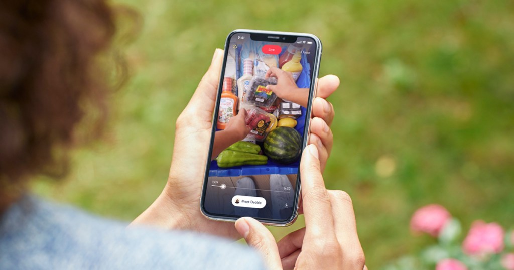 customer watching Walmart InHome Delivery on phone