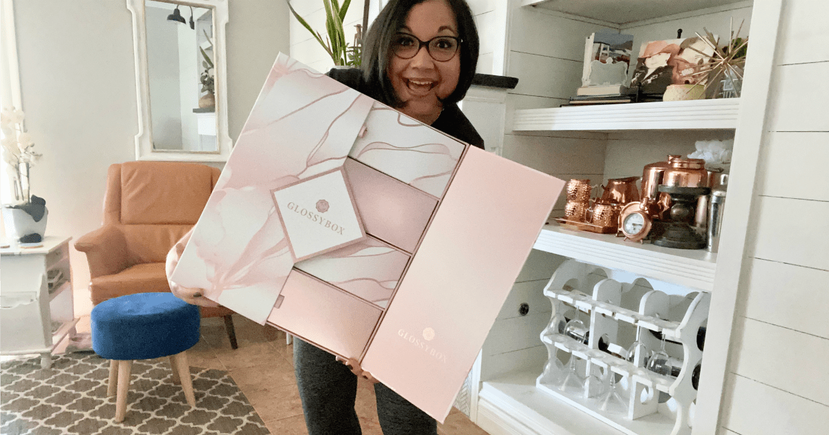 woman holding glossy box advent calendar 