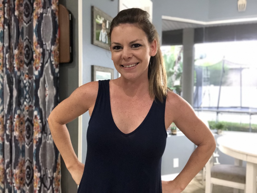 woman smiling wearing black tank top