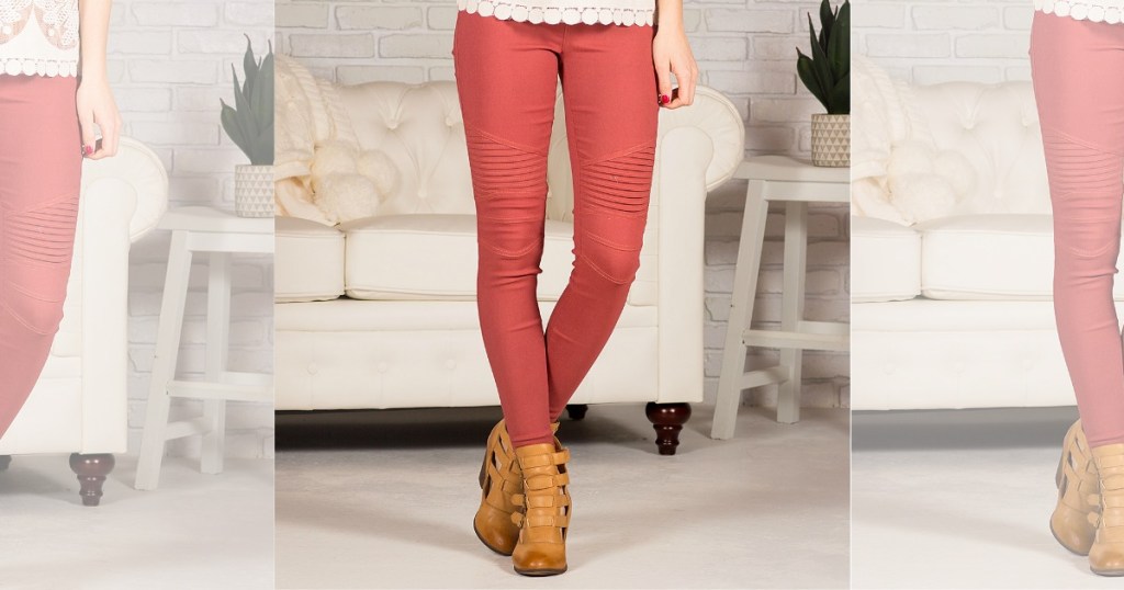 woman wearing salmon colored moto jeggings