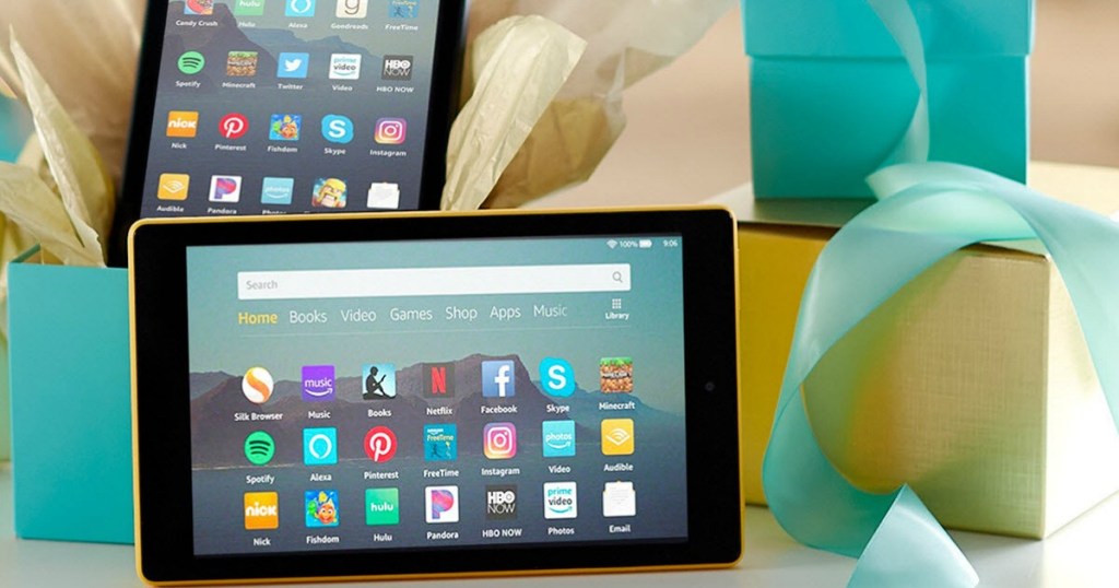 Amazon Fire Tablets next to gift boxes