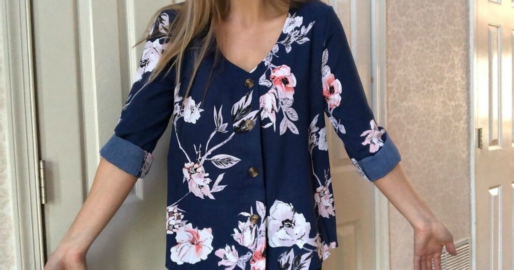 girl wearing a nice shirt in navy blue and floral