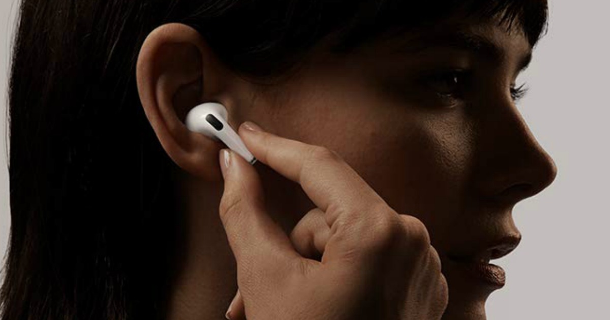 woman putting Apple AirPods Pro in her ear