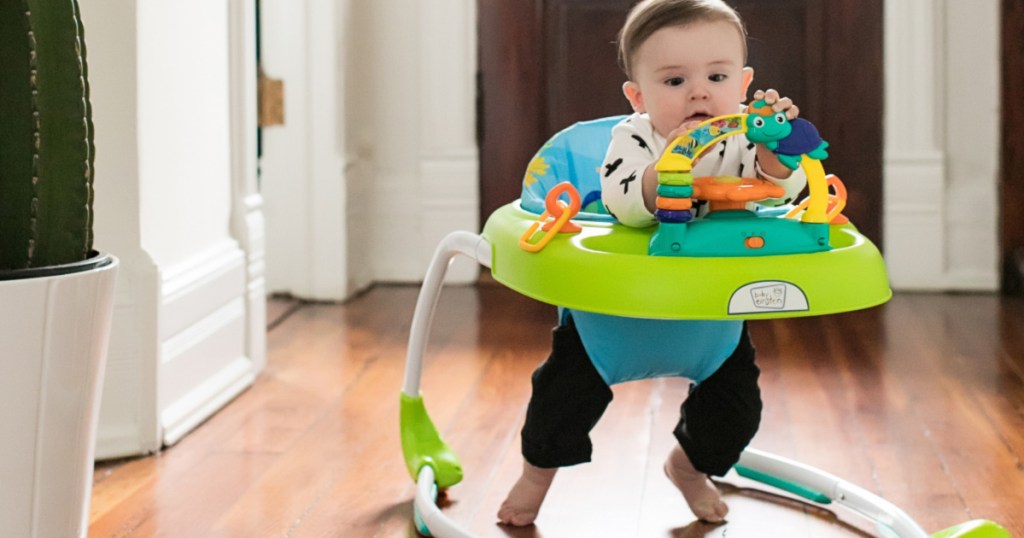 baby walking in Baby Einstein Sky Explorers Walker on hardwood floor