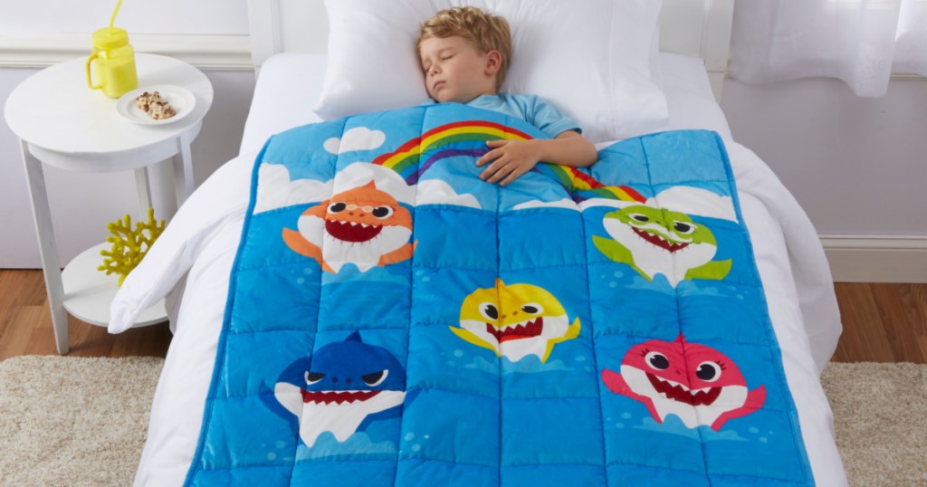 kid sleeping with baby shark weighted blanket