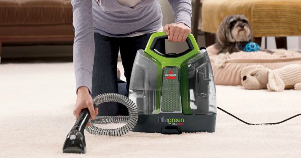 woman using Bissell Little Green ProHeat on carpets