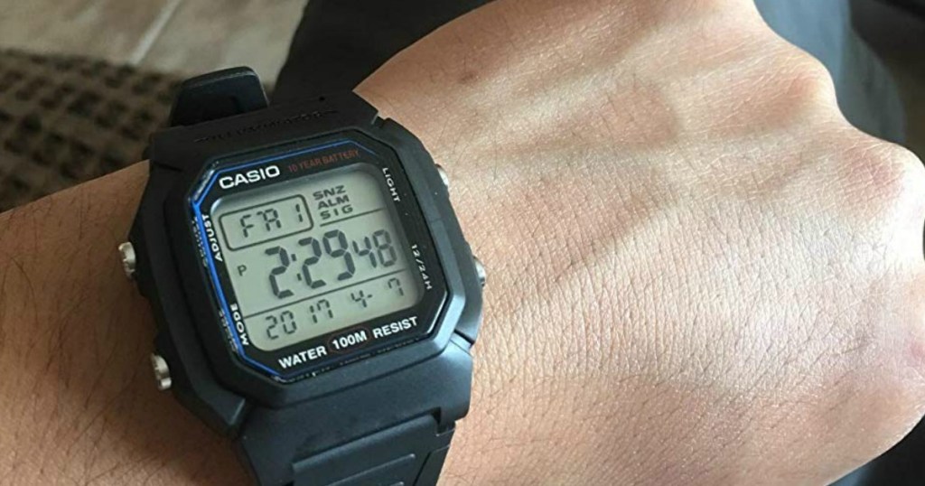 person wearing Casio watch on wrist