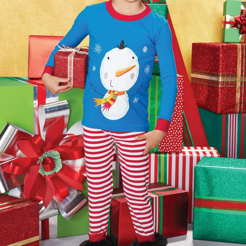 Boy wearing snowman themed pajamas