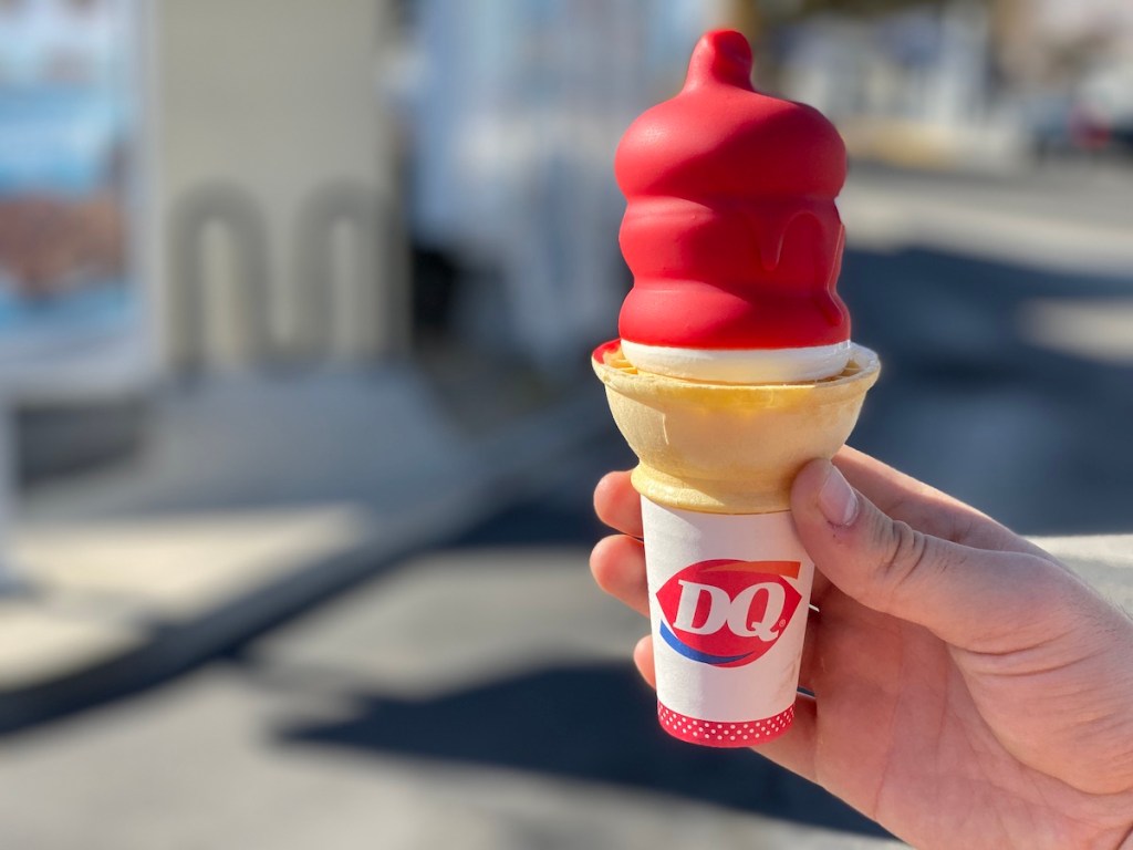 Man holding Cherry Dipped Cone