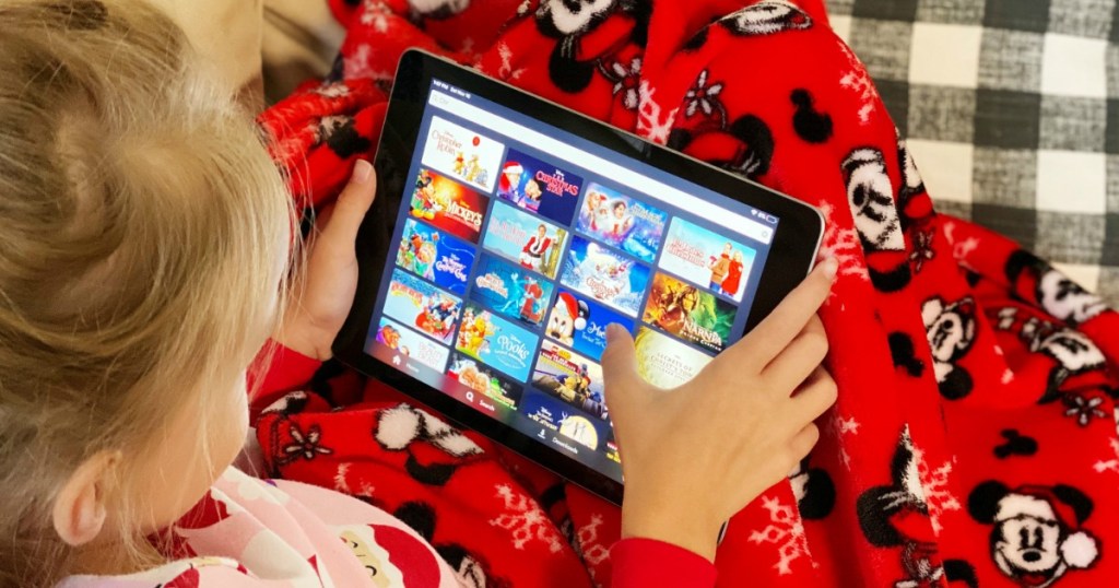 Girl watching Disney movies on iPad