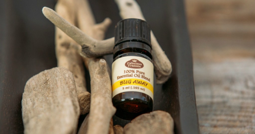 bottle of Fabulous Frannie Bug Away Essential Oil on rock