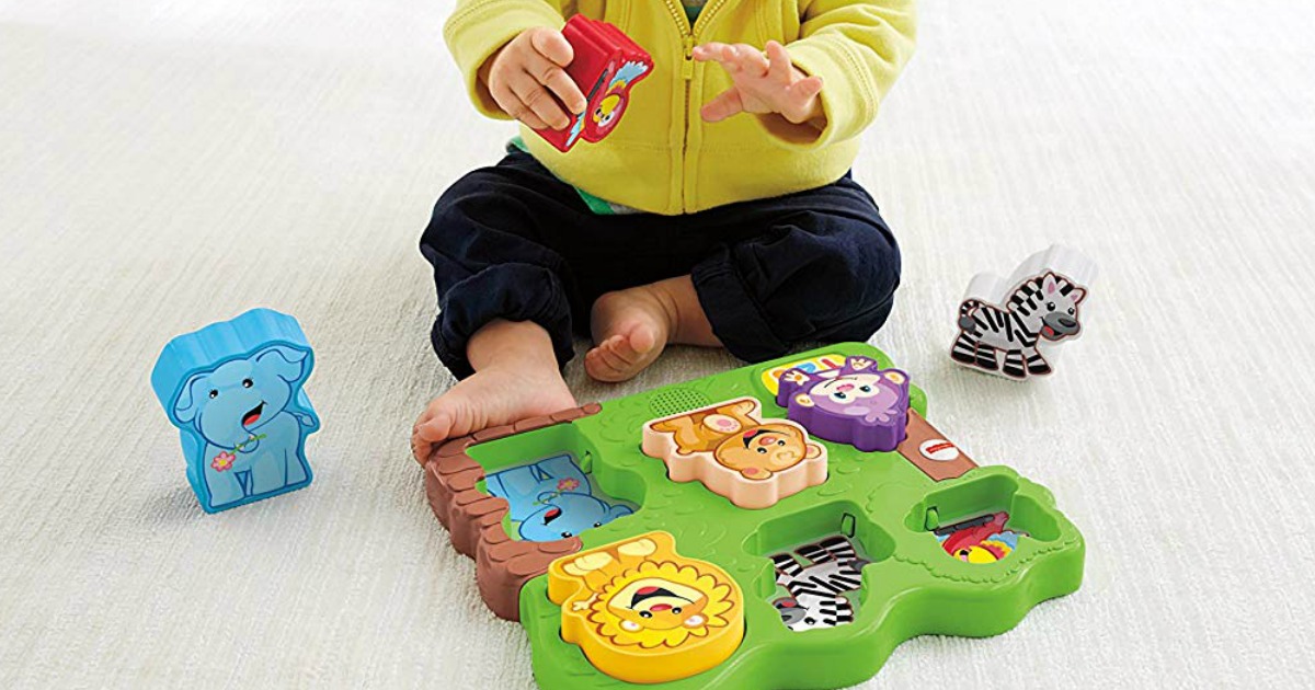 boy playing with Fisher-Price Animal Puzzle