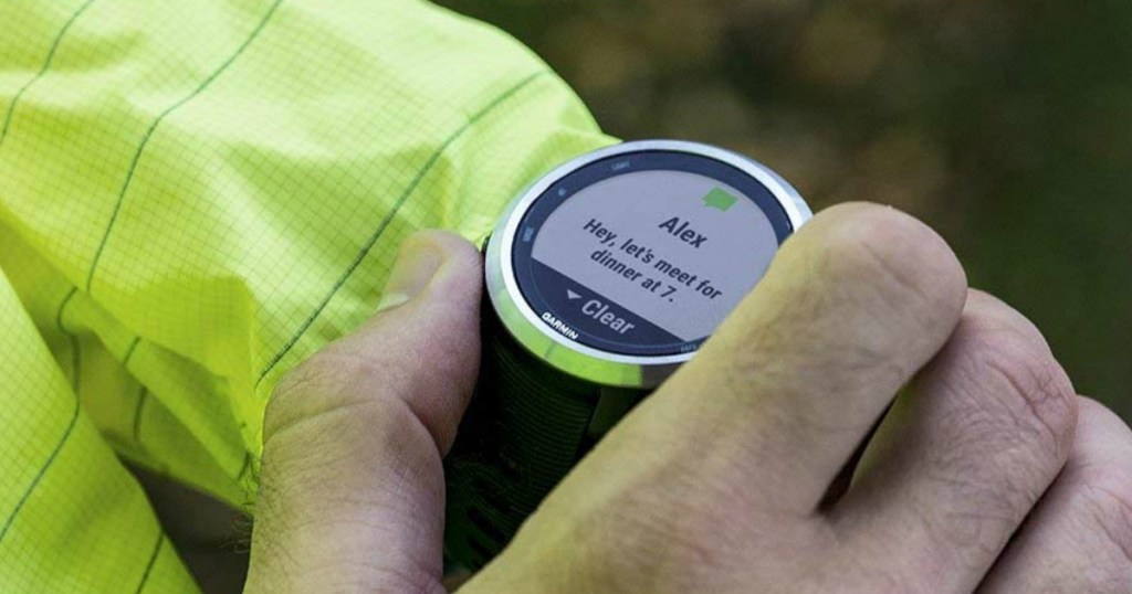 person using a Garmin Forerunner 645 smartwatch