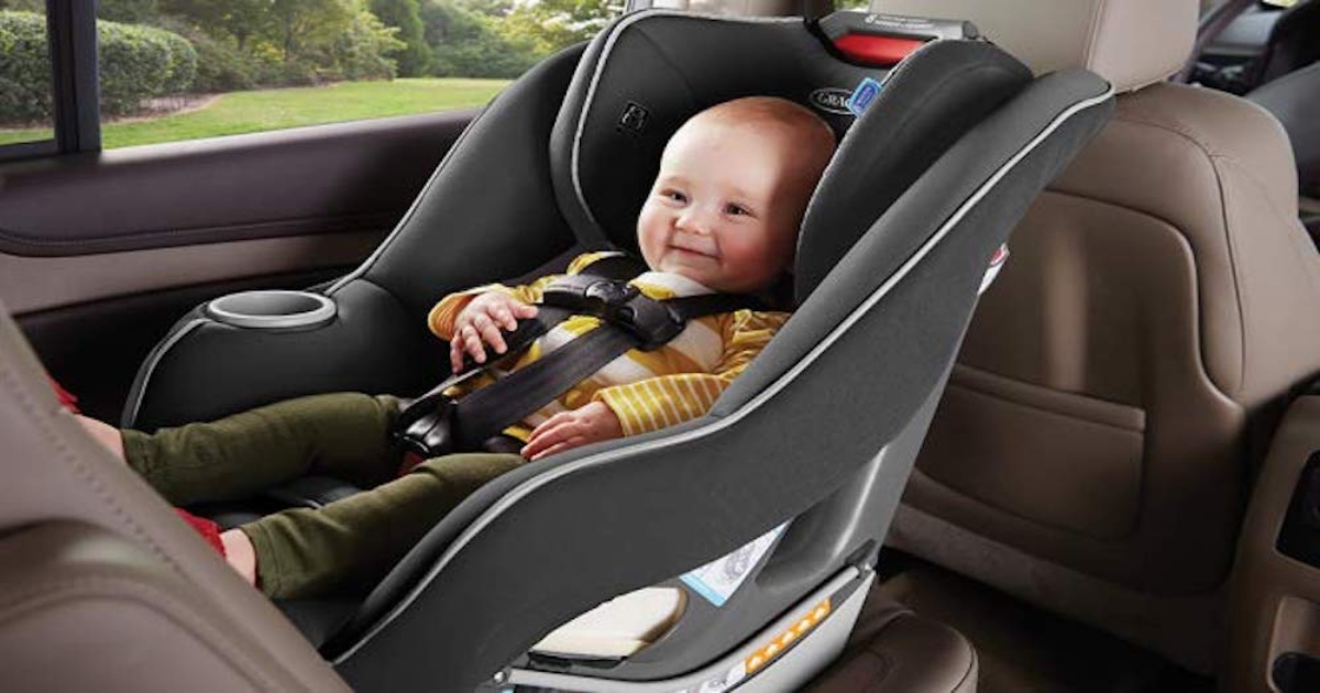 Baby in Graco Admiral car seat, in back seat of car