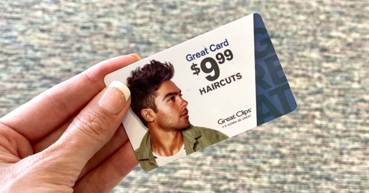 Hand holding a great clips prepaid haircut card