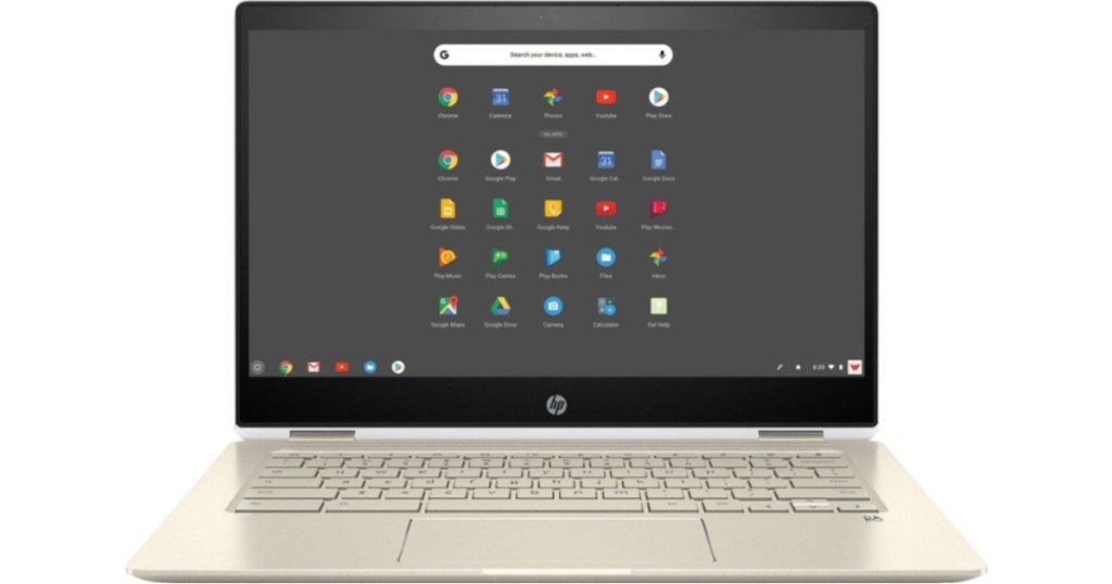 laptop with home screen on and gold keyboard