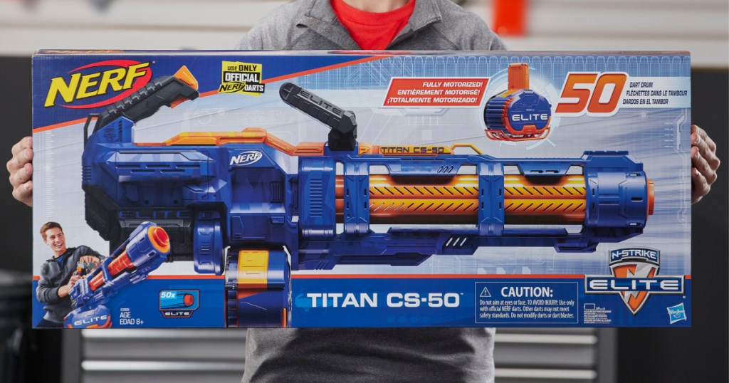 boy holding up nerf titan elite box