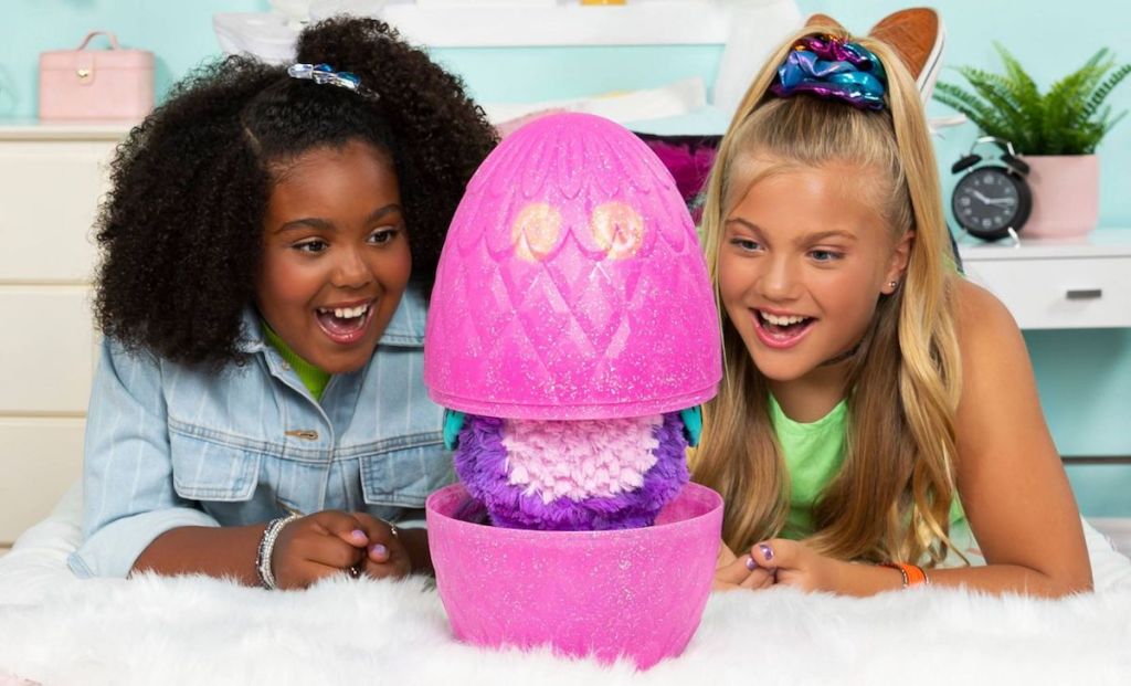 girls watching Hatchimals egg hatch