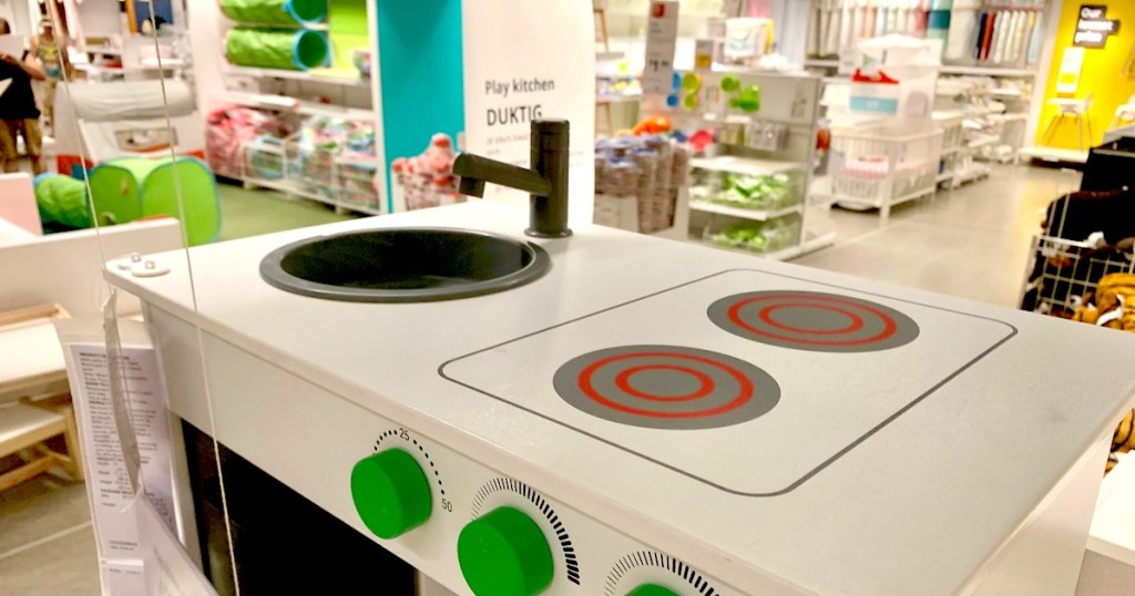 IKEA kids kitchen with green knobs