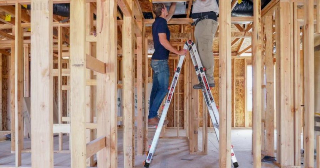 people standing on Little Giant Ladder