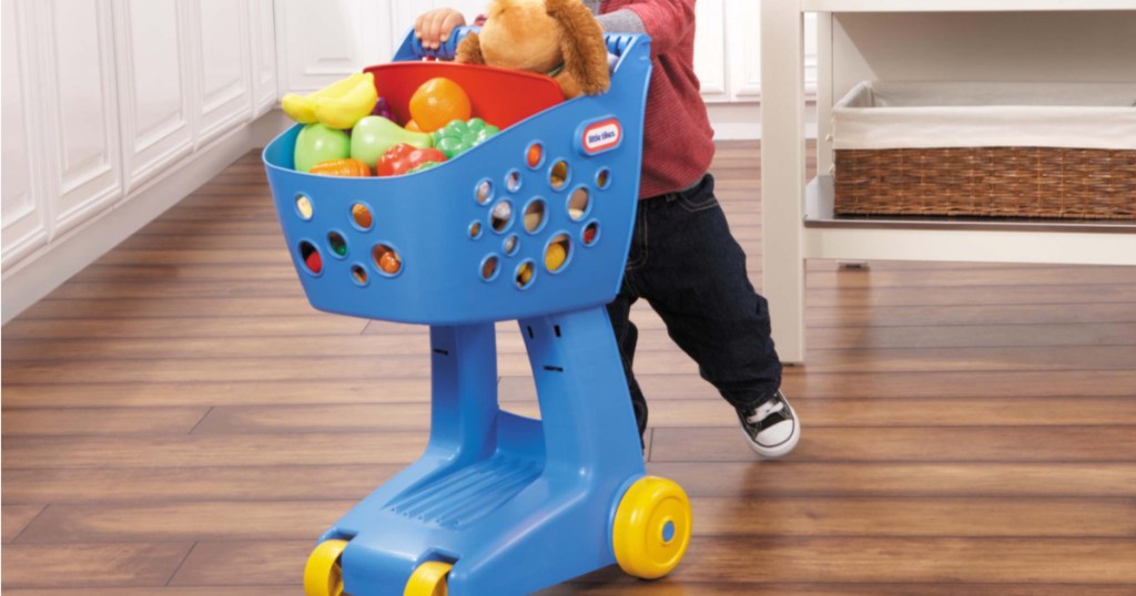 kid playing with blue little tikes lil shopper