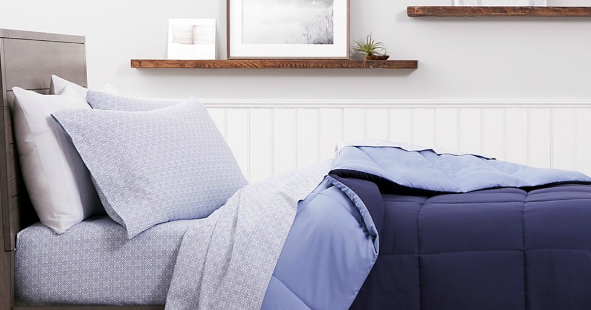 bed with navy blue sheets & bedding