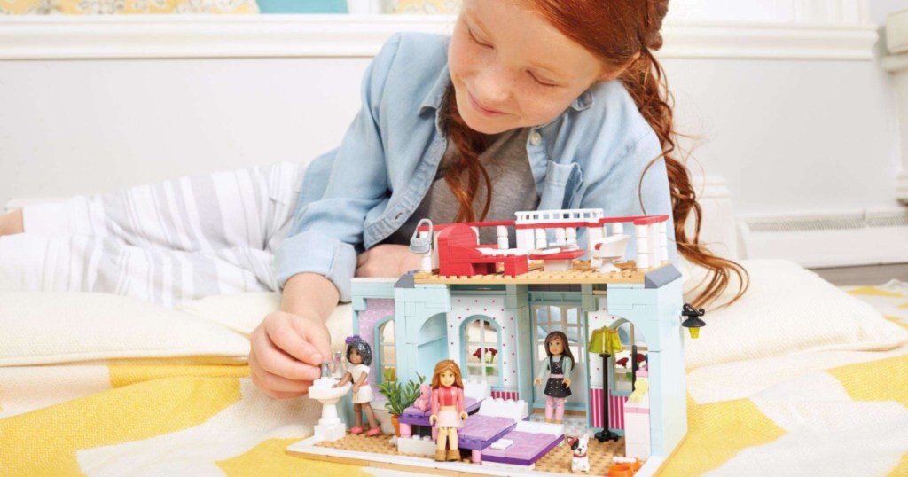 girl playing with american girl house