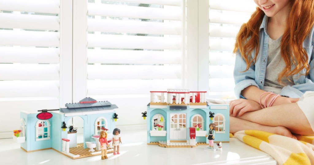 girl playing with mega bloks american girl home