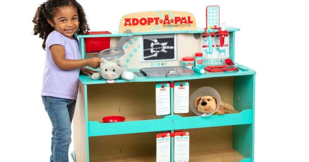 girl playing with Melissa & Doug Adopt a Pal Center