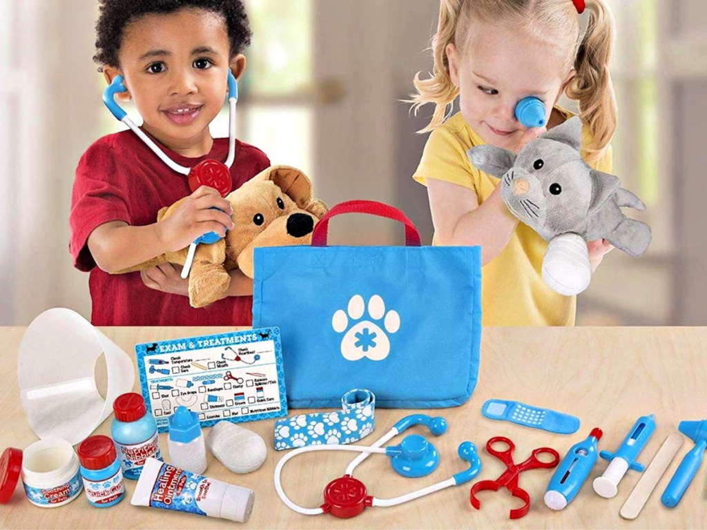 Melissa & Doug Examine And Treat Pet Vet Play Set with kids