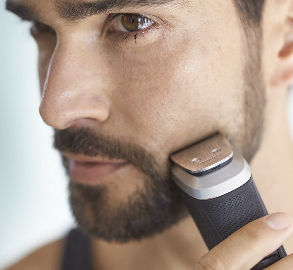 man shaving his face