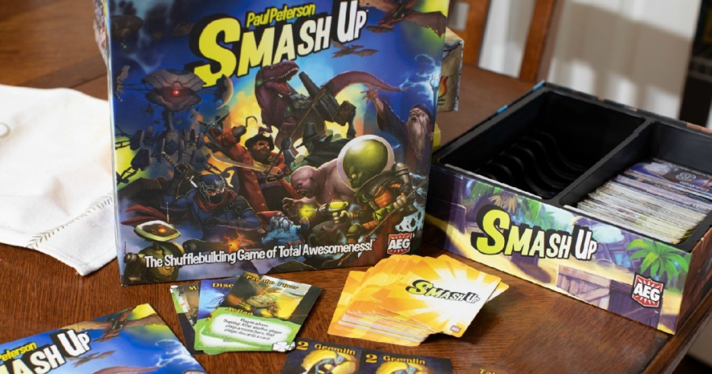 Smash Up Card Game on table with cards and instructions out