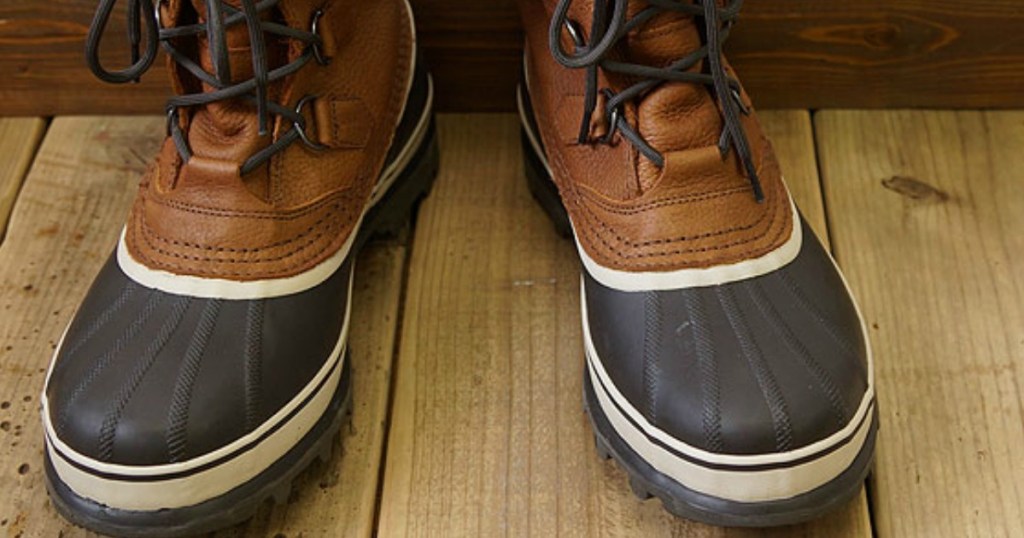 Sorel Caribou Boots on wood deck