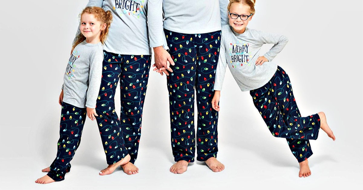 family wearing Christmas ornament fleece PJ pants