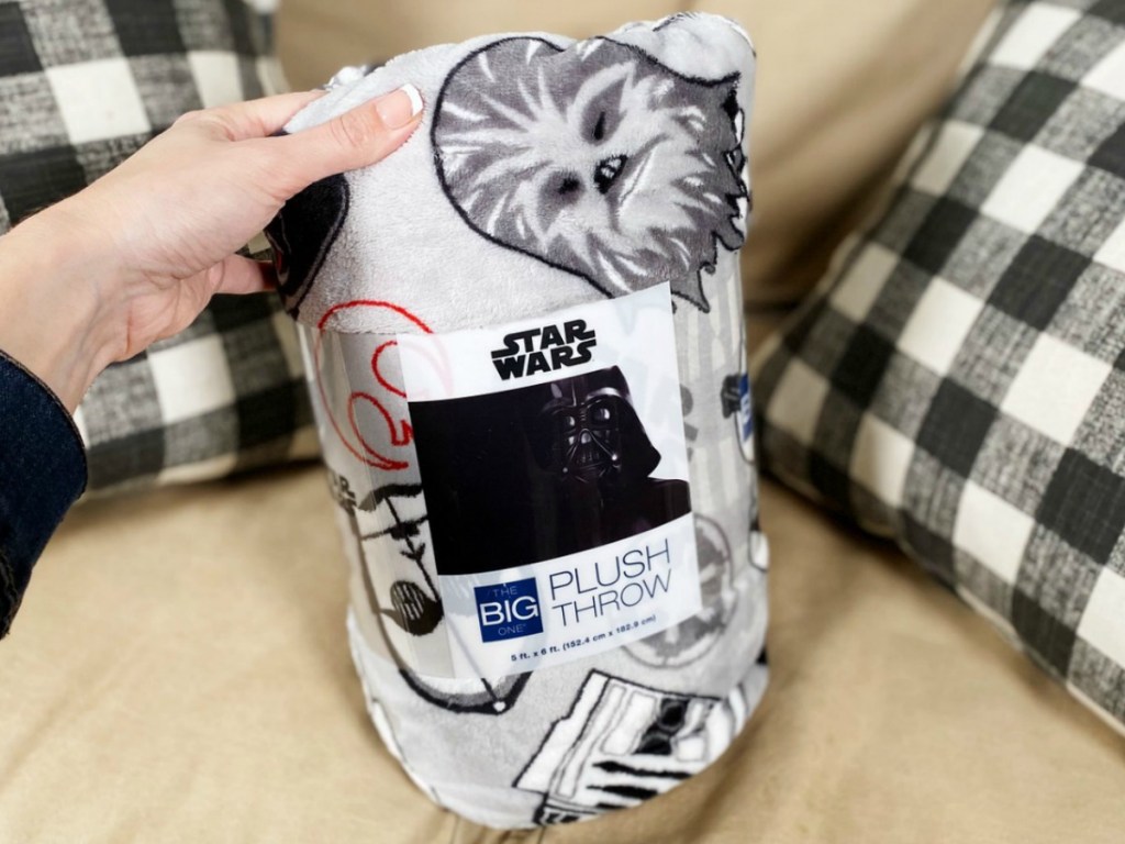 Star Wars print throw blanket in package on sofa