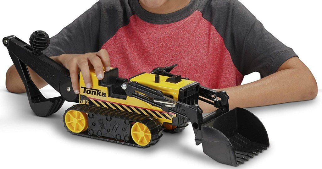 boy playing with Tonka Trencher