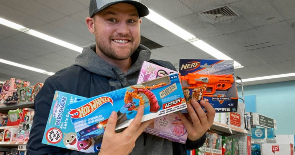 Stetson holding toys at Walgreens